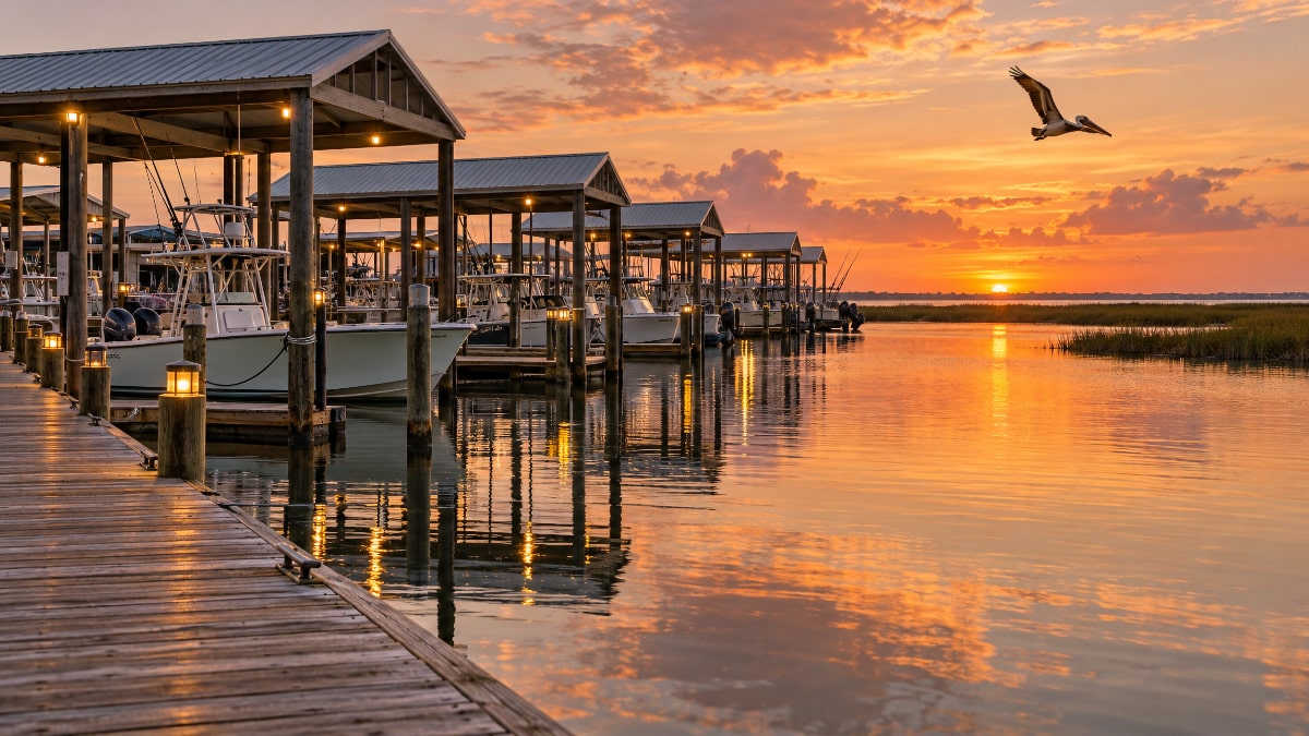 Covered boat slips at Waterman's Marina Galveston on West Bay at golden hour